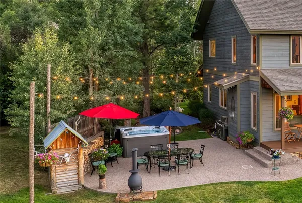 an outdoor space with furniture and umbrella