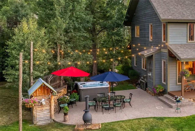 an outdoor space with furniture and umbrella
