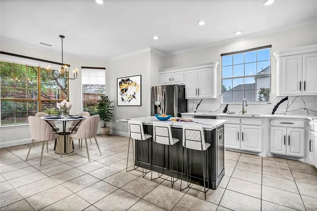 a kitchen with sink cabinets and stove