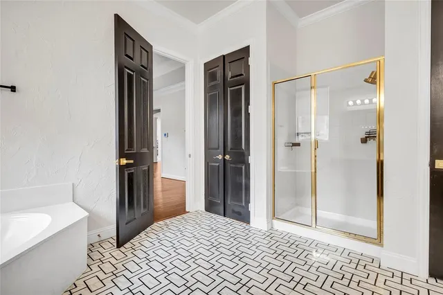 a bathroom with a bathtub and a shower