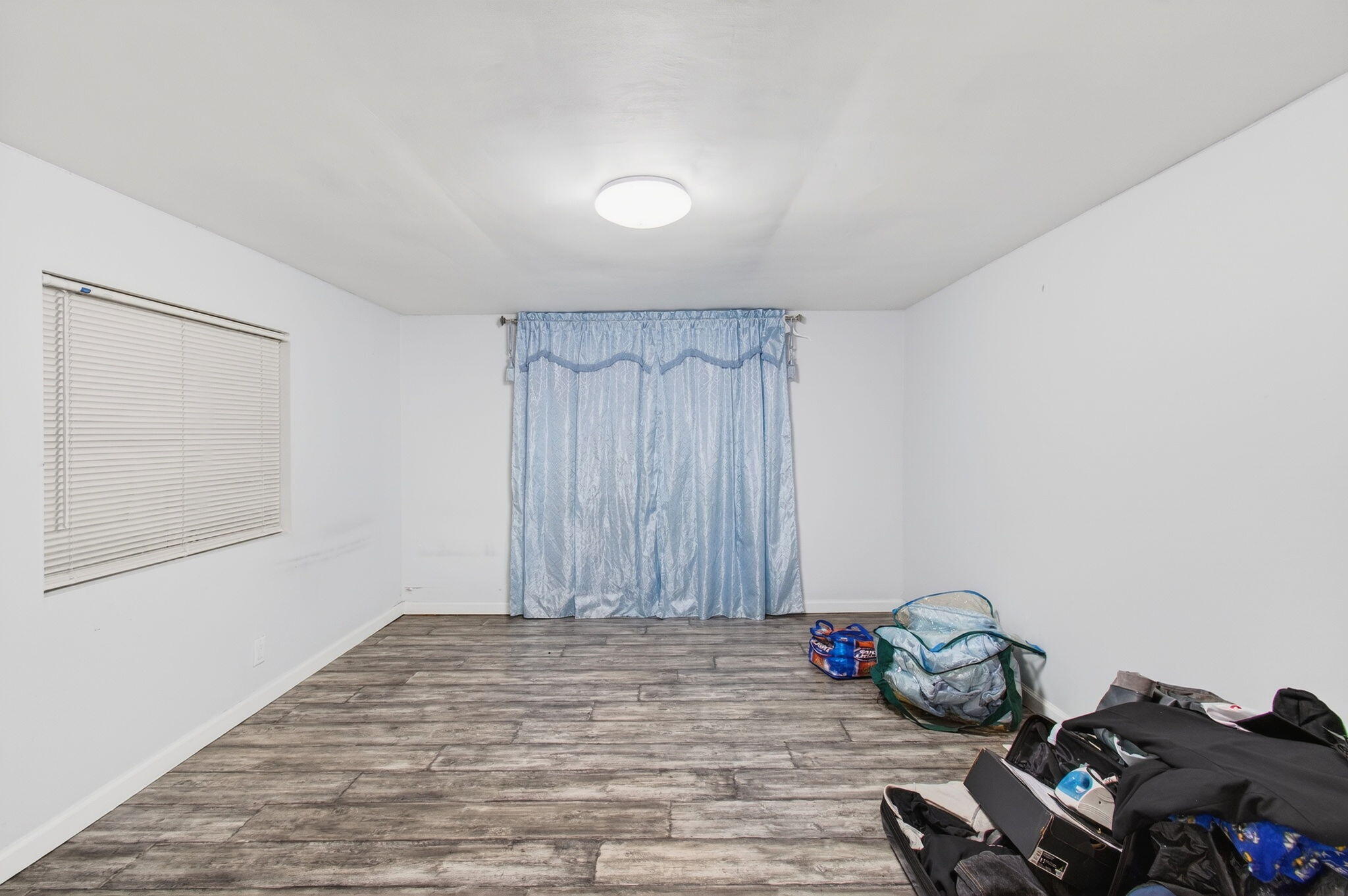 22849 Tradewind Road Boca Raton, FL 33428 - Photo 26 of 60 a view of a room with wooden floor and air conditioner