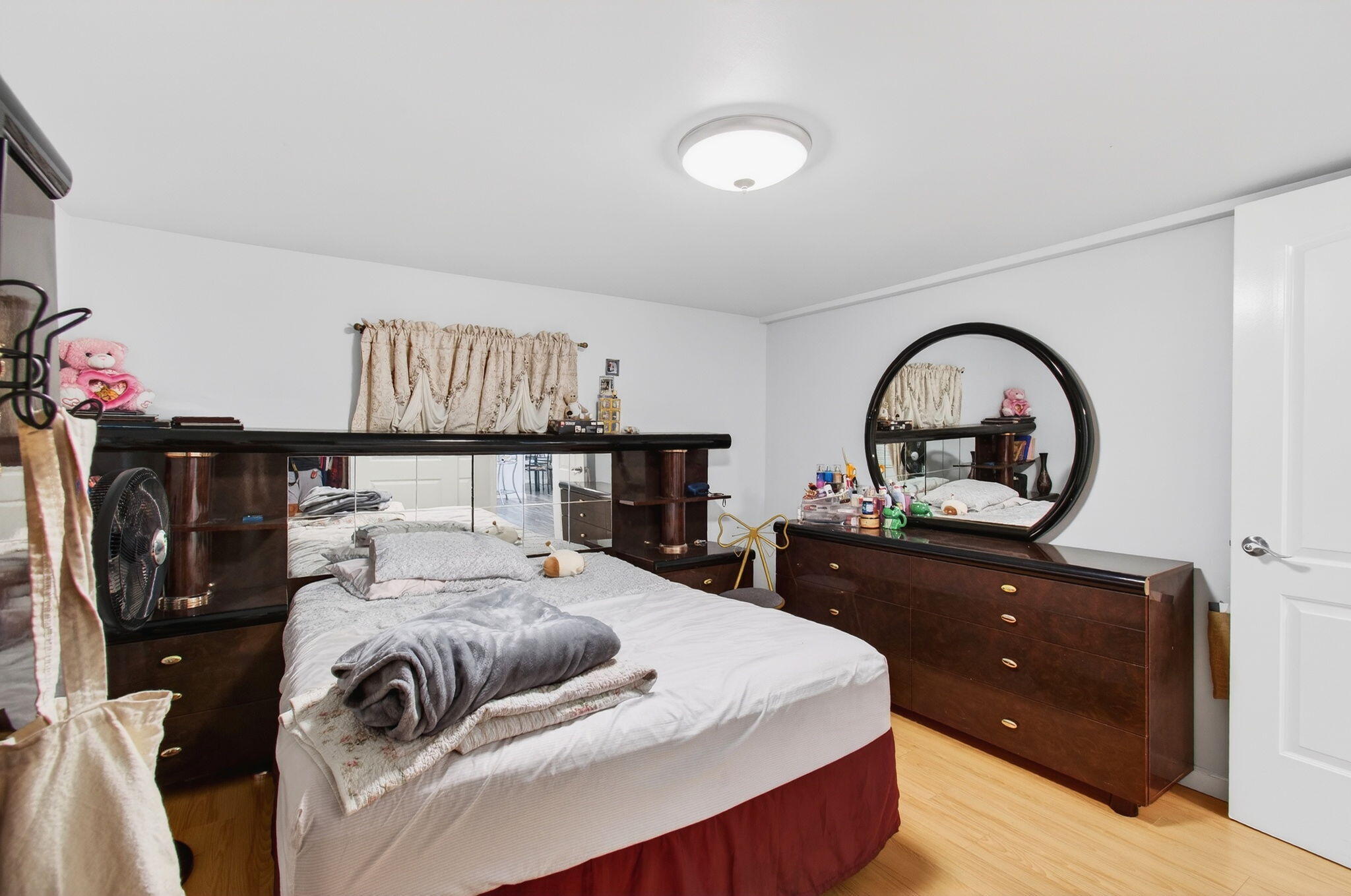 22849 Tradewind Road Boca Raton, FL 33428 - Photo 39 of 60 a bedroom with a bed and a dresser
