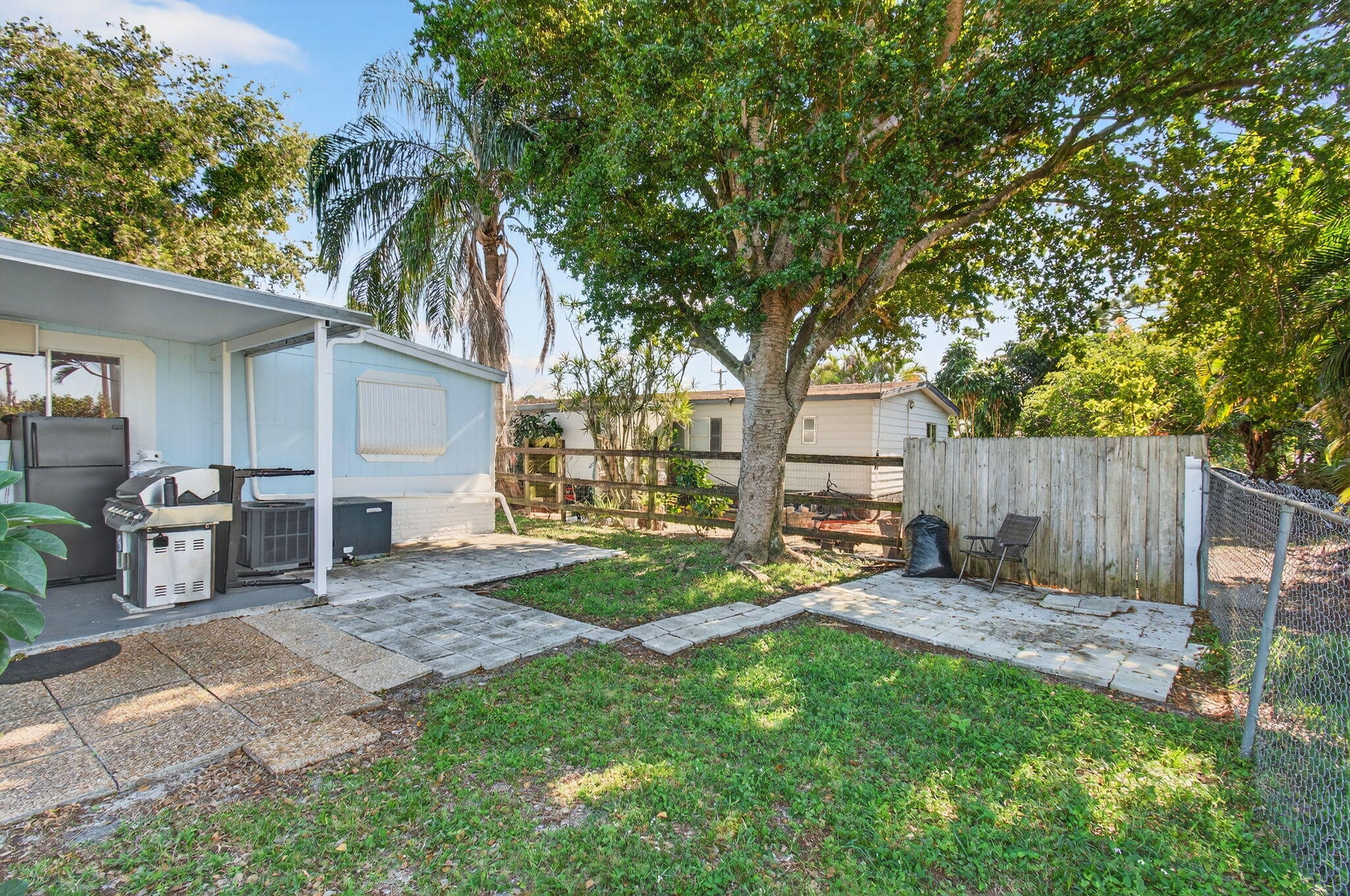 22849 Tradewind Road Boca Raton, FL 33428 - Photo 60 of 60 a view of a backyard with a tree