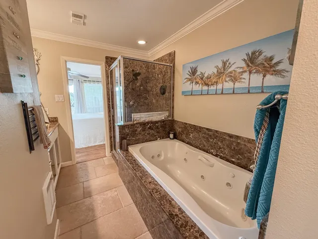 a bathroom with a bathtub and a sink