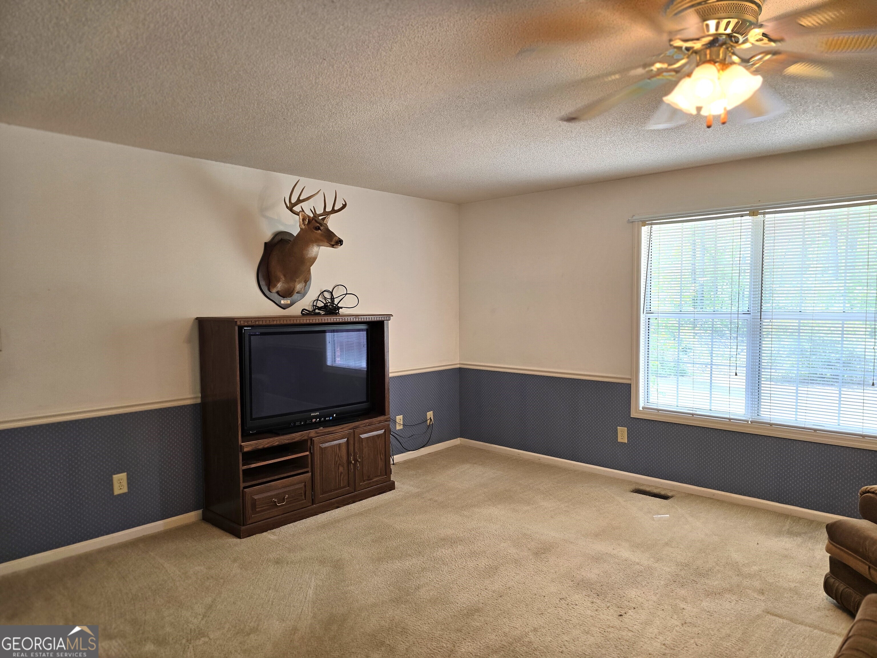 2096 Old Quaker Road Wrens, GA 30833 - Photo 11 of 23 a bedroom with furniture and flat screen tv