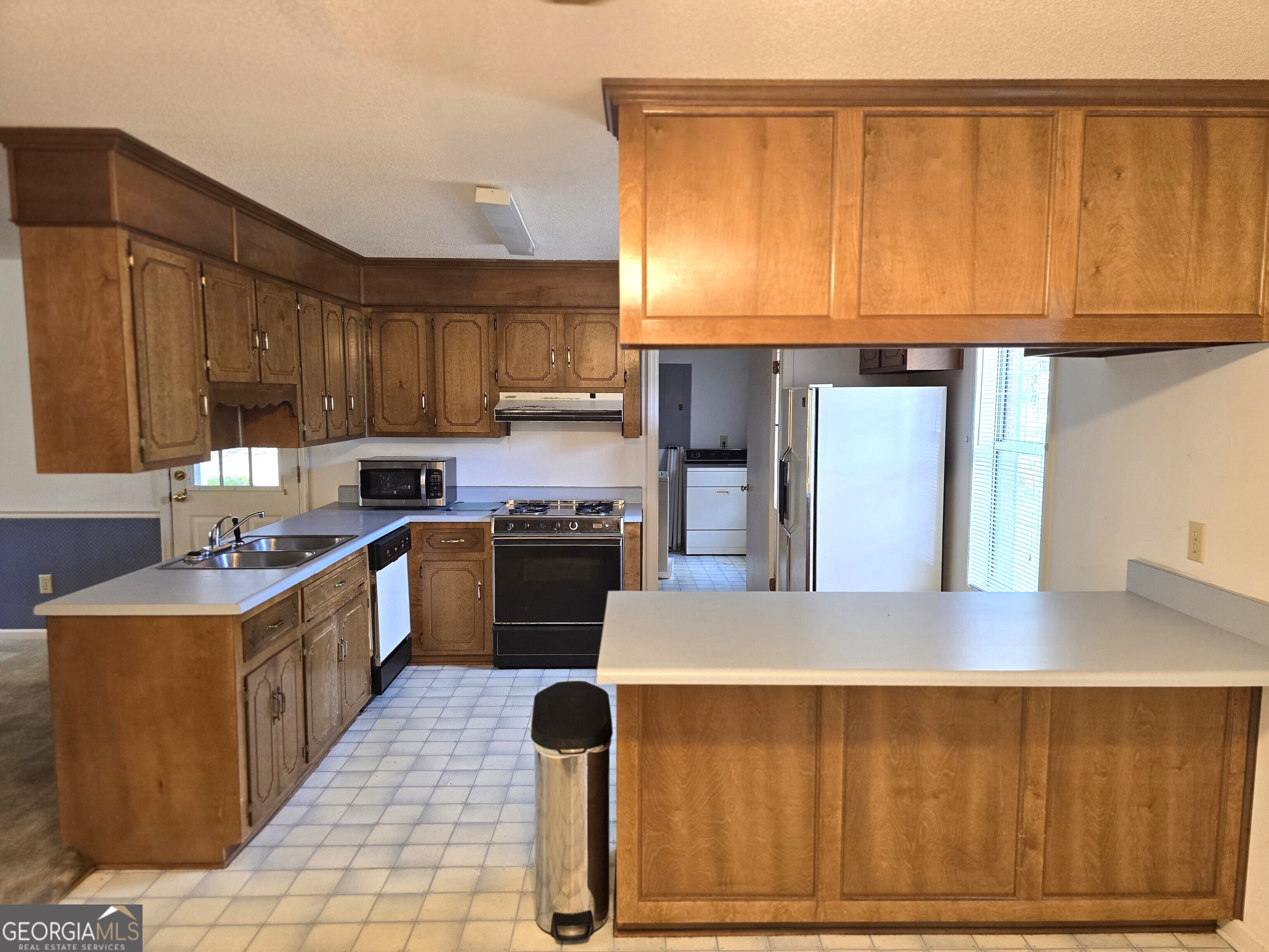 2096 Old Quaker Road Wrens, GA 30833 - Photo 14 of 23 a kitchen with a sink cabinets and window