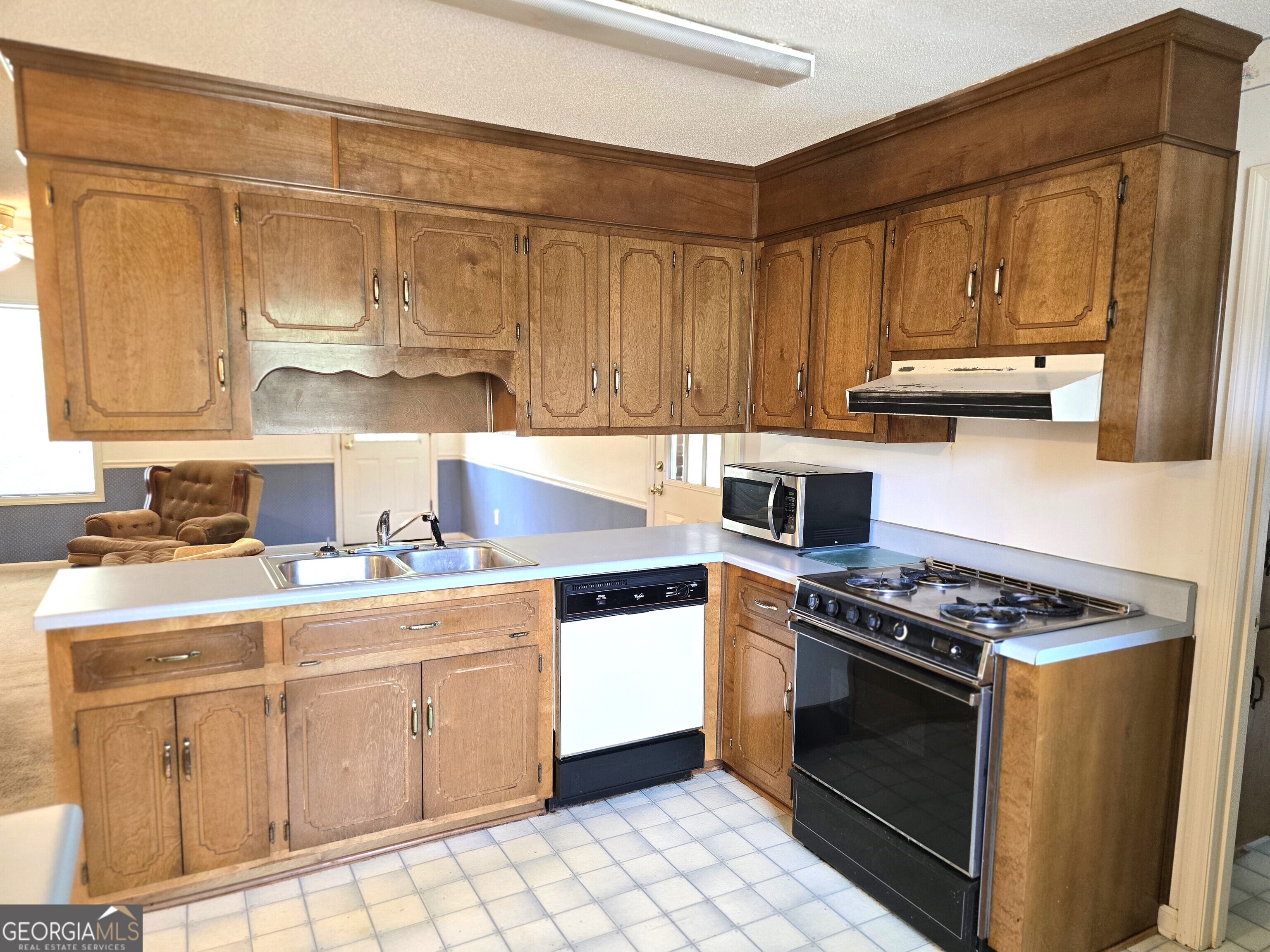 2096 Old Quaker Road Wrens, GA 30833 - Photo 15 of 23 a kitchen with cabinets appliances and a counter top space