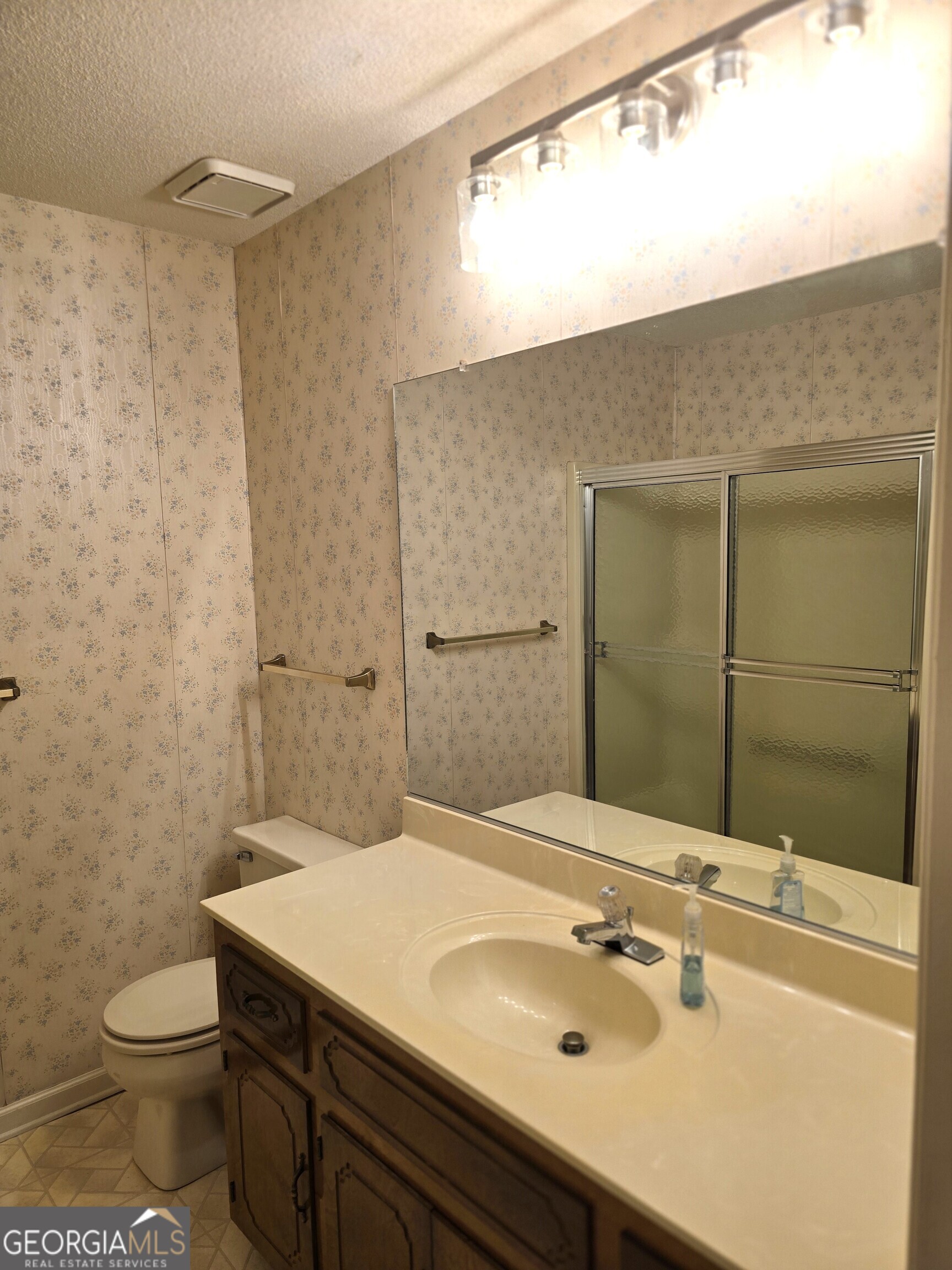 2096 Old Quaker Road Wrens, GA 30833 - Photo 18 of 23 a bathroom with a sink a toilet and shower