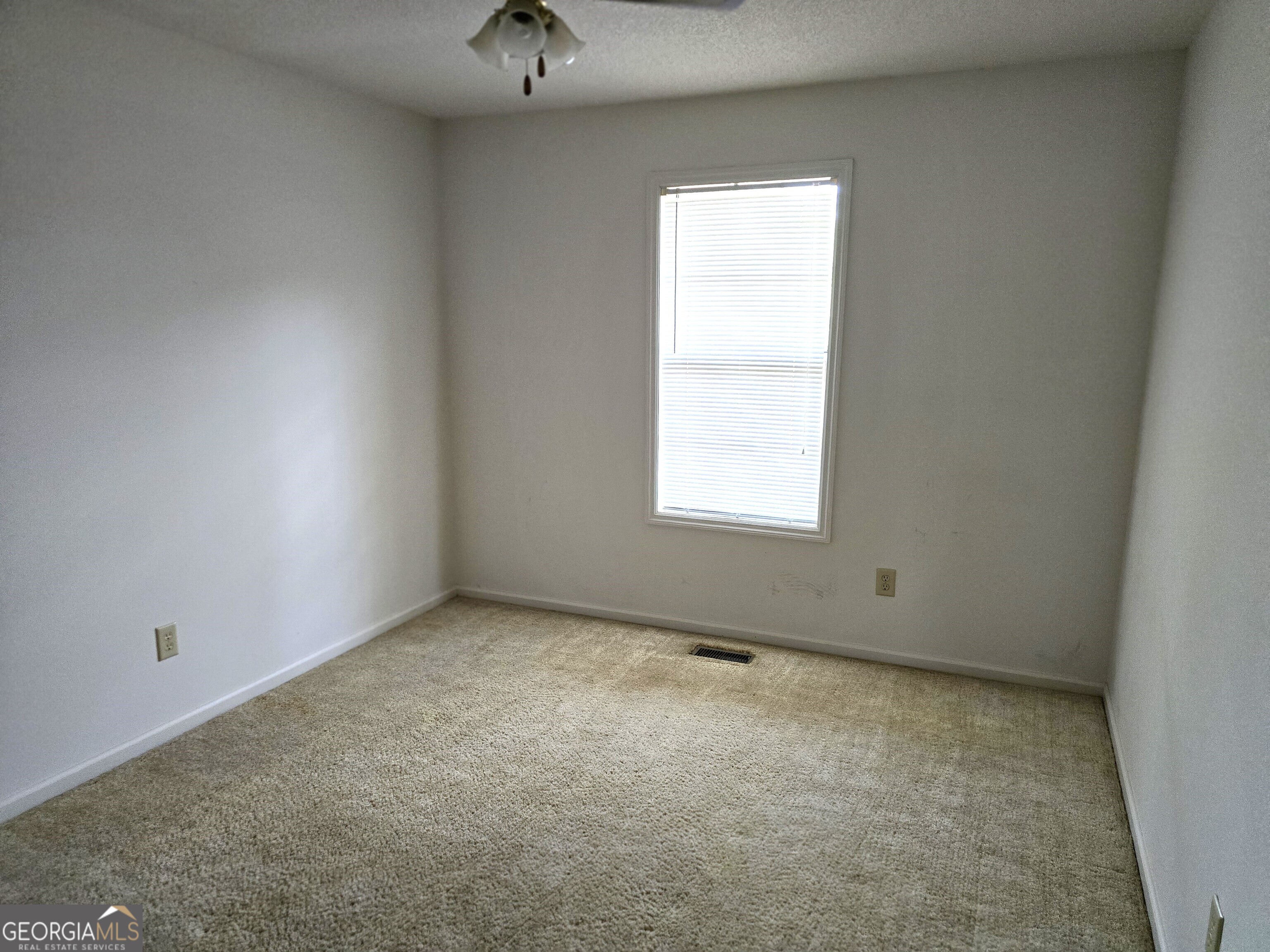2096 Old Quaker Road Wrens, GA 30833 - Photo 20 of 23 an empty room with a window