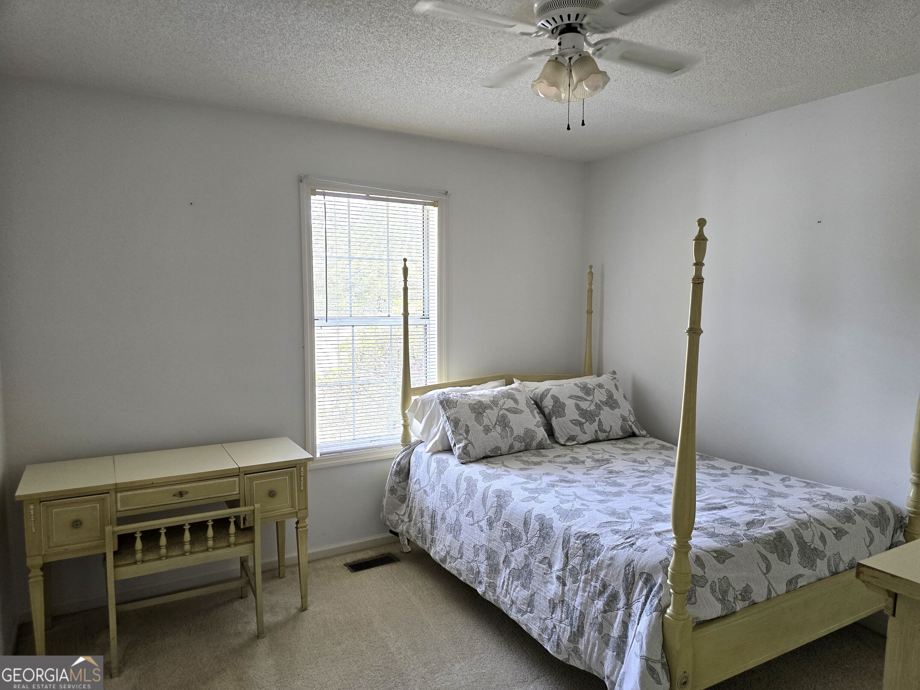 2096 Old Quaker Road Wrens, GA 30833 - Photo 21 of 23 a bedroom with a bed and a ceiling fan