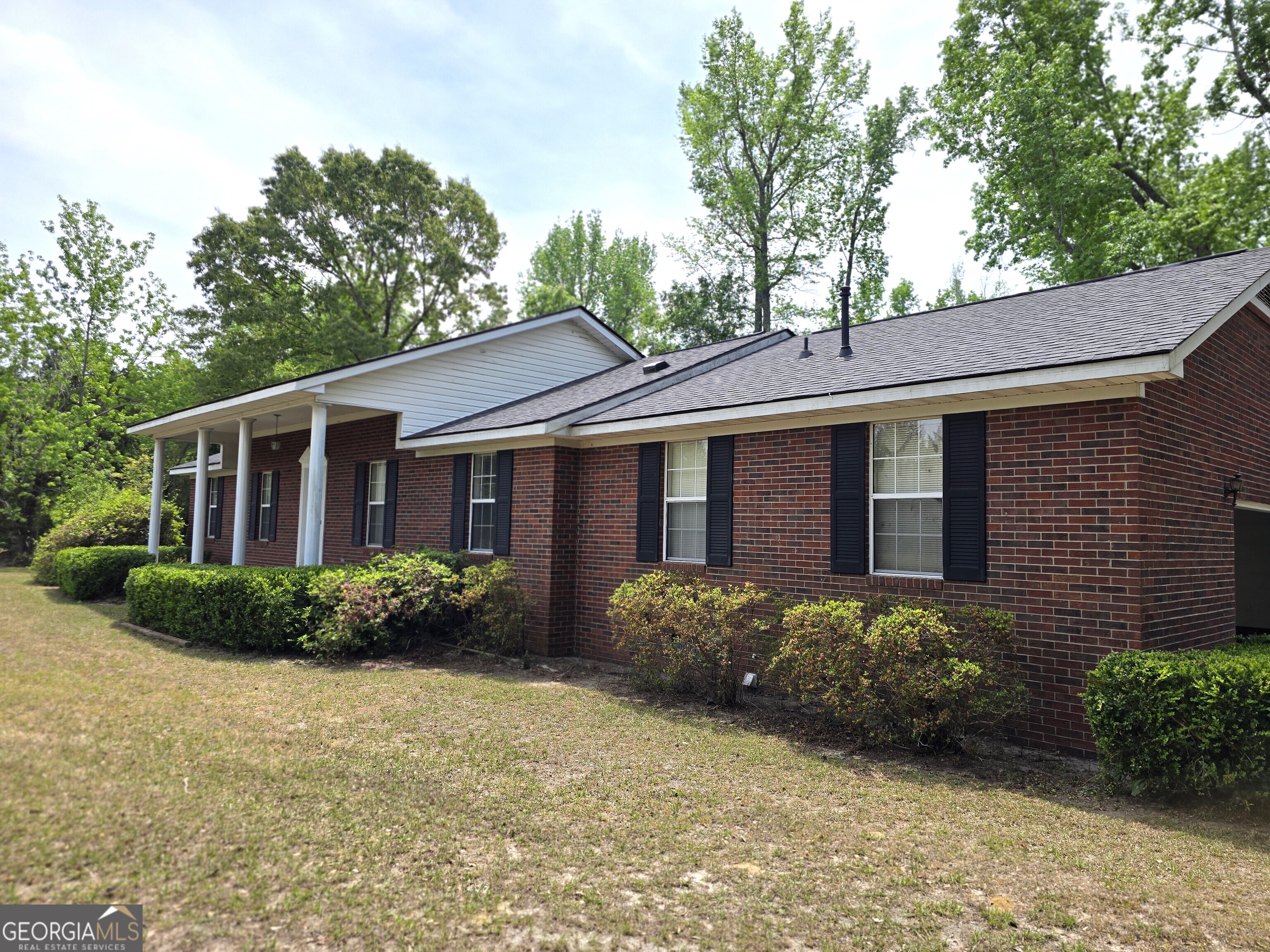 2096 Old Quaker Road Wrens, GA 30833 - Photo 4 of 23 a front view of a house with garden