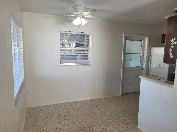 a view of a kitchen with a dishwasher cabinets and a wooden floor