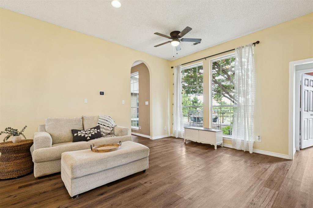 13768 Stirrup Court Forney, TX 75126 - Photo 12 of 32 a living room with furniture and a large window
