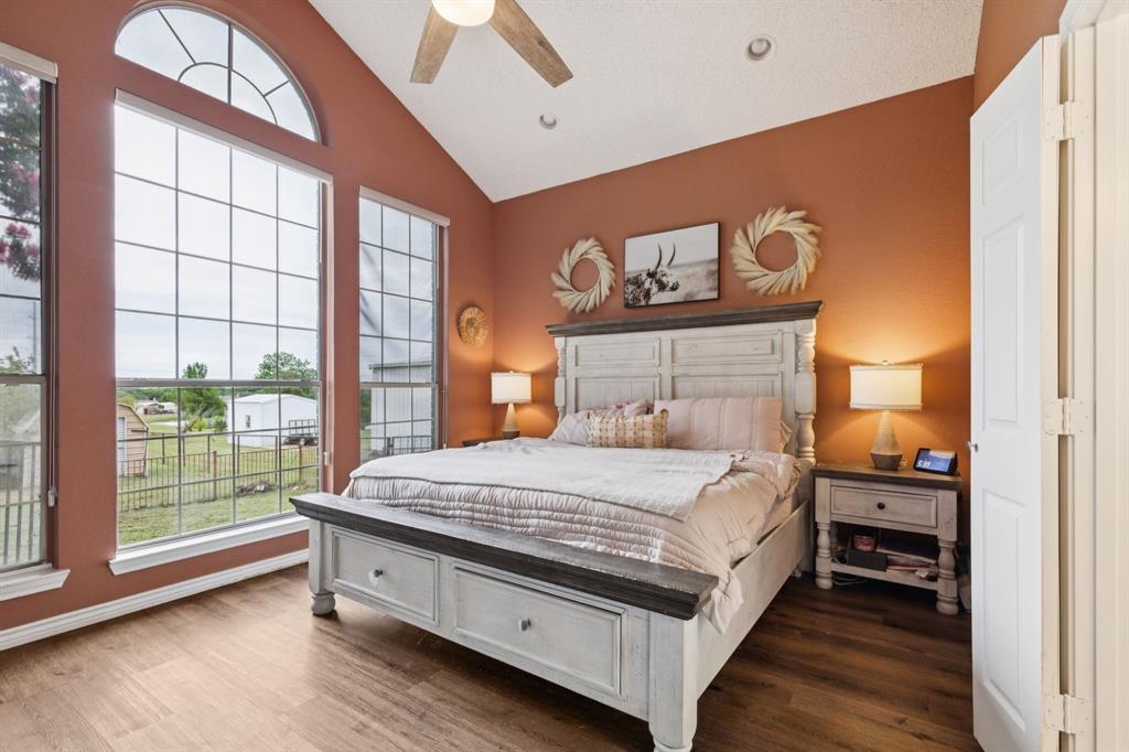 13768 Stirrup Court Forney, TX 75126 - Photo 13 of 32 a bedroom with a bed and a large window