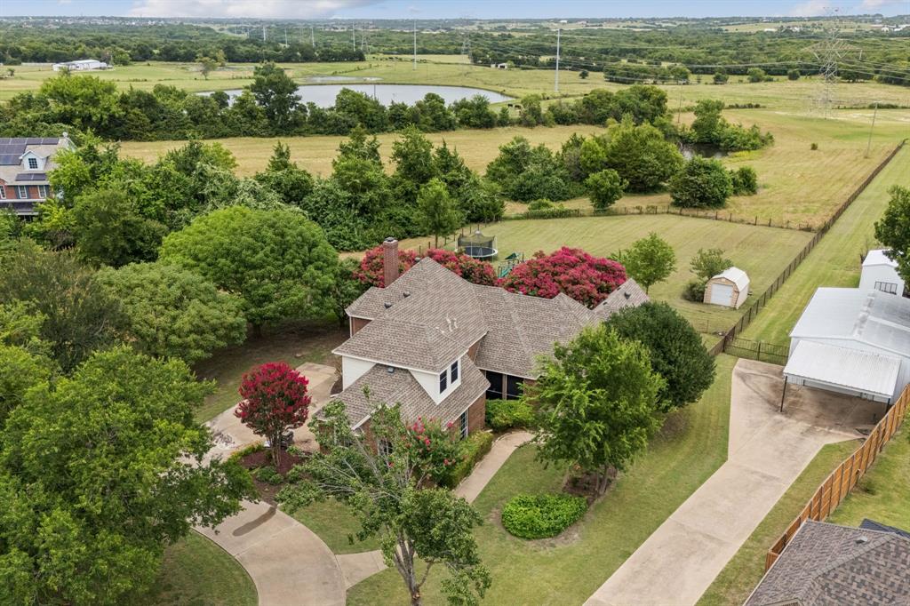 13768 Stirrup Court Forney, TX 75126 - Photo 2 of 32 an aerial view of residential houses with outdoor space and river