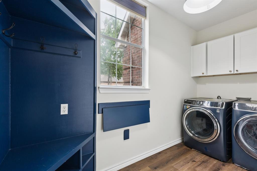 13768 Stirrup Court Forney, TX 75126 - Photo 24 of 32 a view of a storage and utility room with washer and dryer