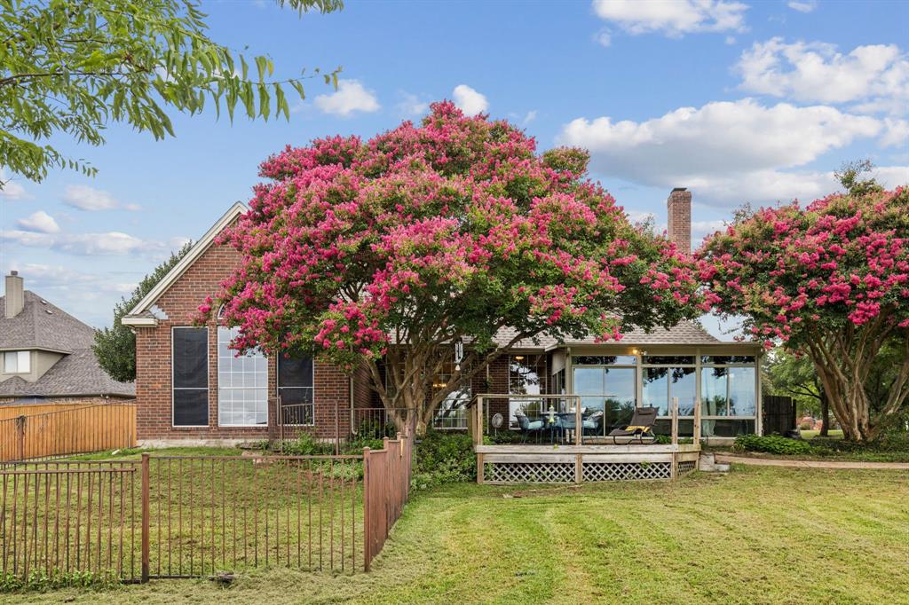 13768 Stirrup Court Forney, TX 75126 - Photo 27 of 32 a front view of a house with a garden and plants