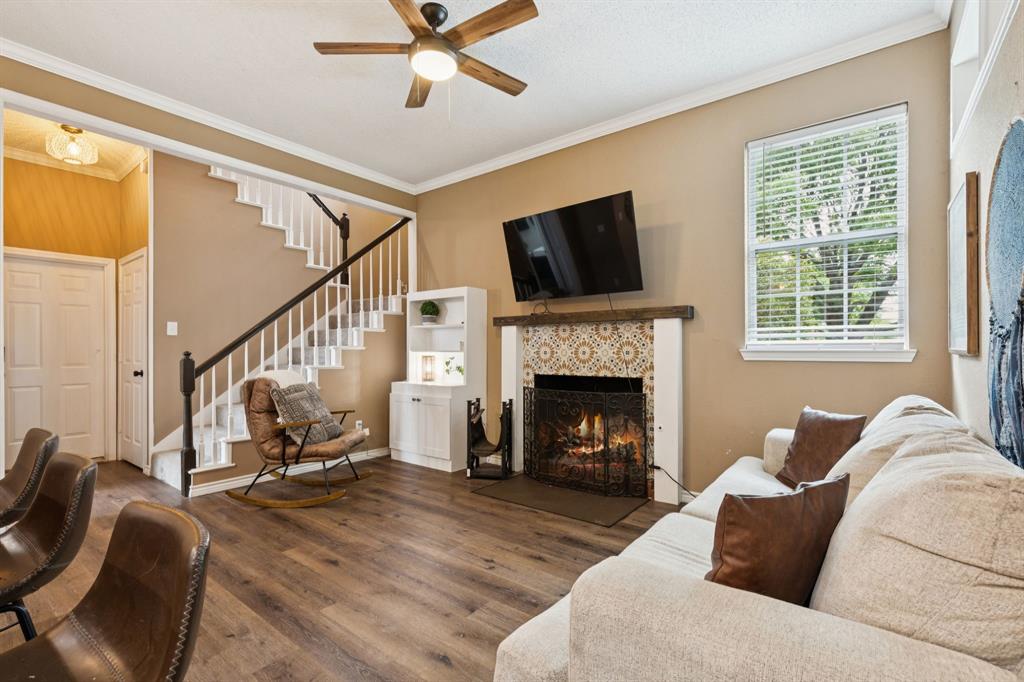 13768 Stirrup Court Forney, TX 75126 - Photo 4 of 32 a living room with furniture fireplace and a flat screen tv