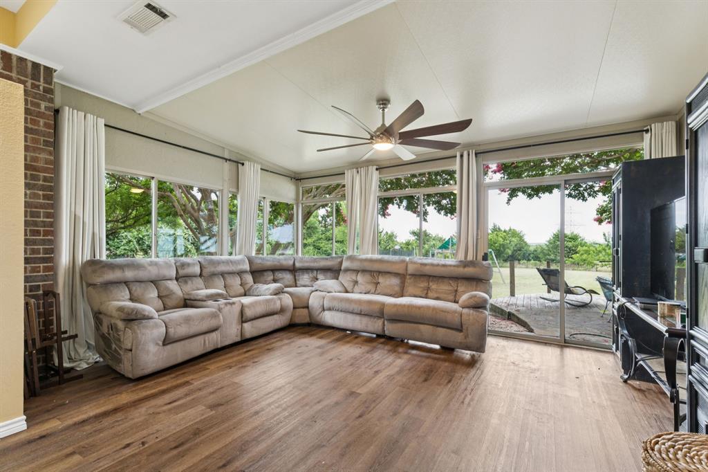 13768 Stirrup Court Forney, TX 75126 - Photo 9 of 32 a living room with furniture and a large window