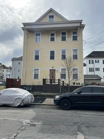 a car parked in front of a house