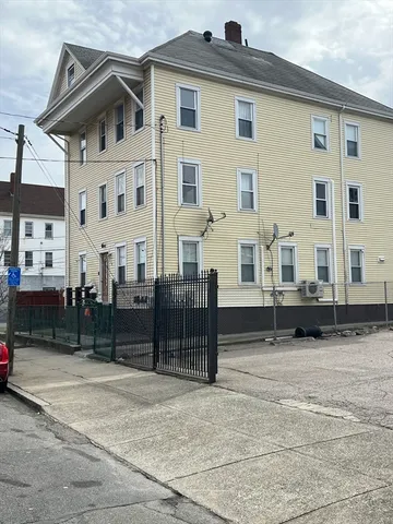 a view of a white house with a outdoor space