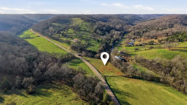 a view of a back yard of a house with a swimming pool