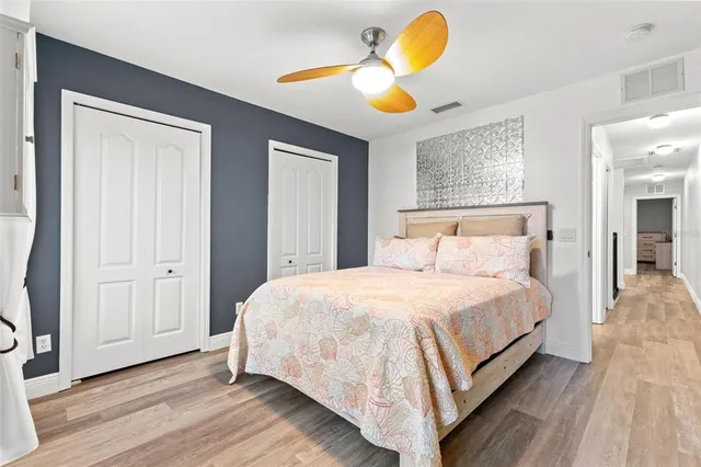 a bedroom with bed and a window