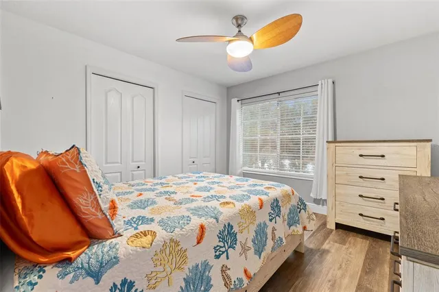 a bedroom with a bed and closet