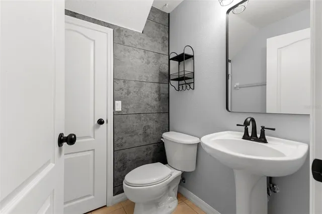 a bathroom with a toilet sink and shower
