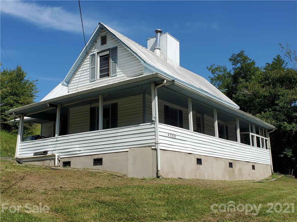 4580 Little Pine Road Marshall, NC 28753 - Photo 2 of 39 a white building with a large window and large space
