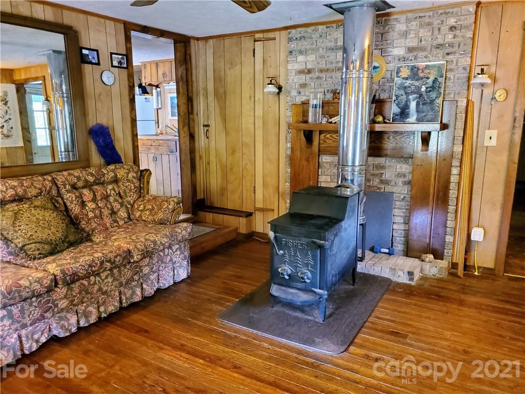 4580 Little Pine Road Marshall, NC 28753 - Photo 12 of 39 a living room with furniture and a fireplace