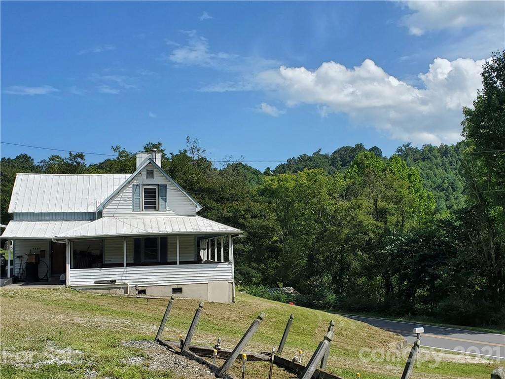 4580 Little Pine Road Marshall, NC 28753 - Photo 4 of 39 a front view of a house with garden