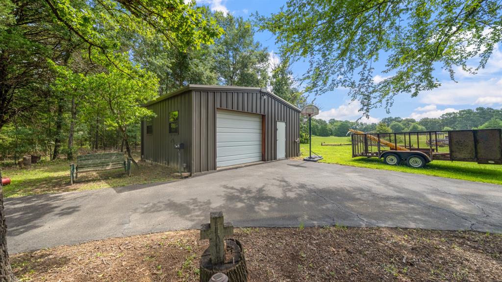 875 Arnold Paul Road Canton, TX 75103 - Photo 24 of 32 a front view of a house with a yard and garage