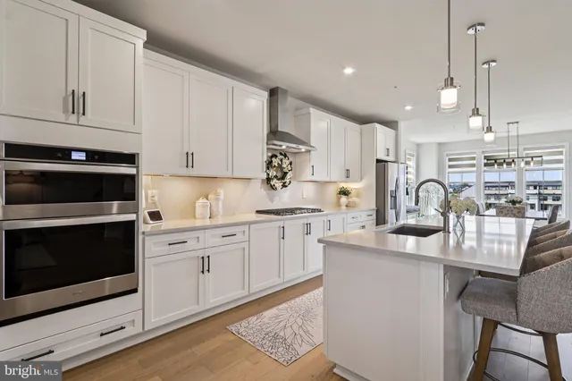 a dining room with furniture window and wooden floor