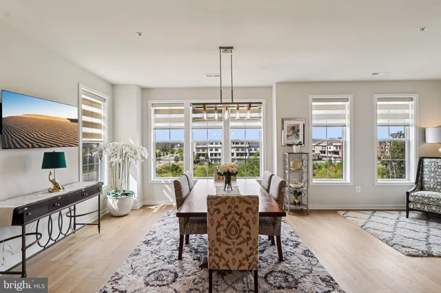a view of a balcony with couches and a potted plant