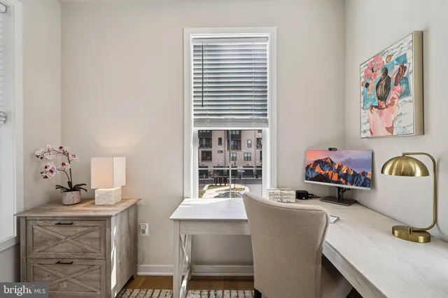 a large bedroom with a bed and a television