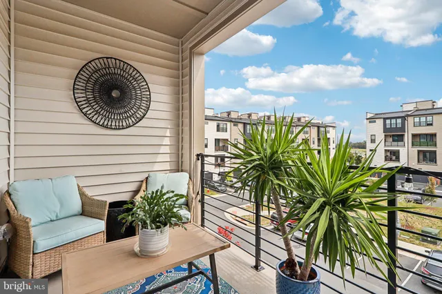 a bathroom with a granite countertop shower a toilet and a sink