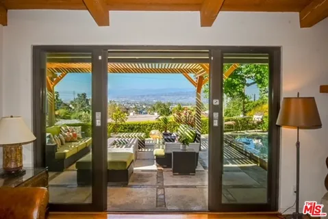 a view of swimming pool from a living room