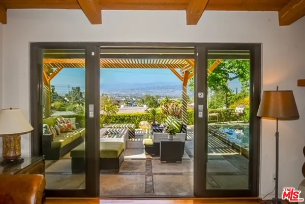 a view of swimming pool from a living room
