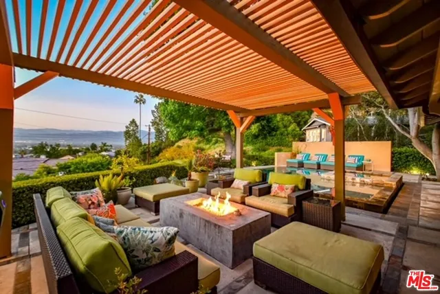 a outdoor living space with furniture and city view