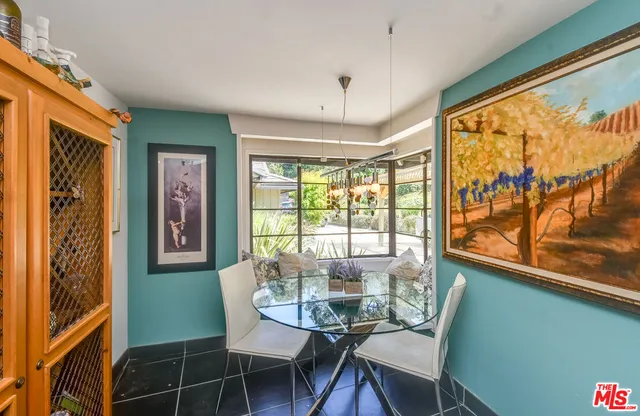 a view of a room with furniture large window and outside view