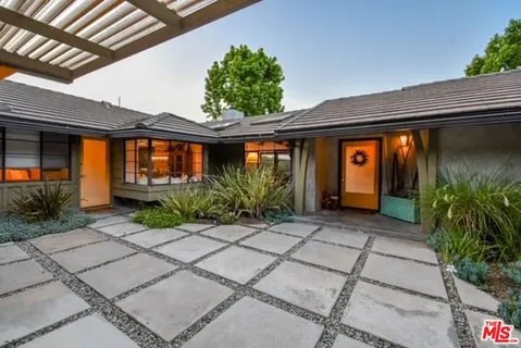 a front view of house with yard outdoor seating and entertaining space