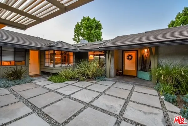 a front view of house with yard outdoor seating and entertaining space