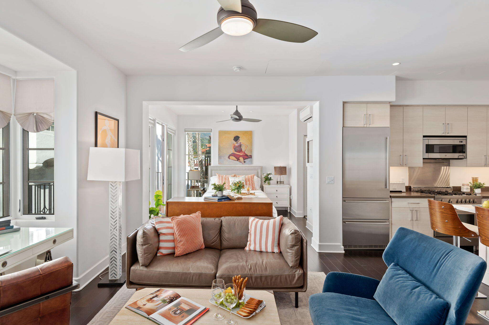 18 West Victoria Street, Unit 303 Santa Barbara, CA 93101 - Photo 2 of 42 a living room with furniture ceiling fan and a rug