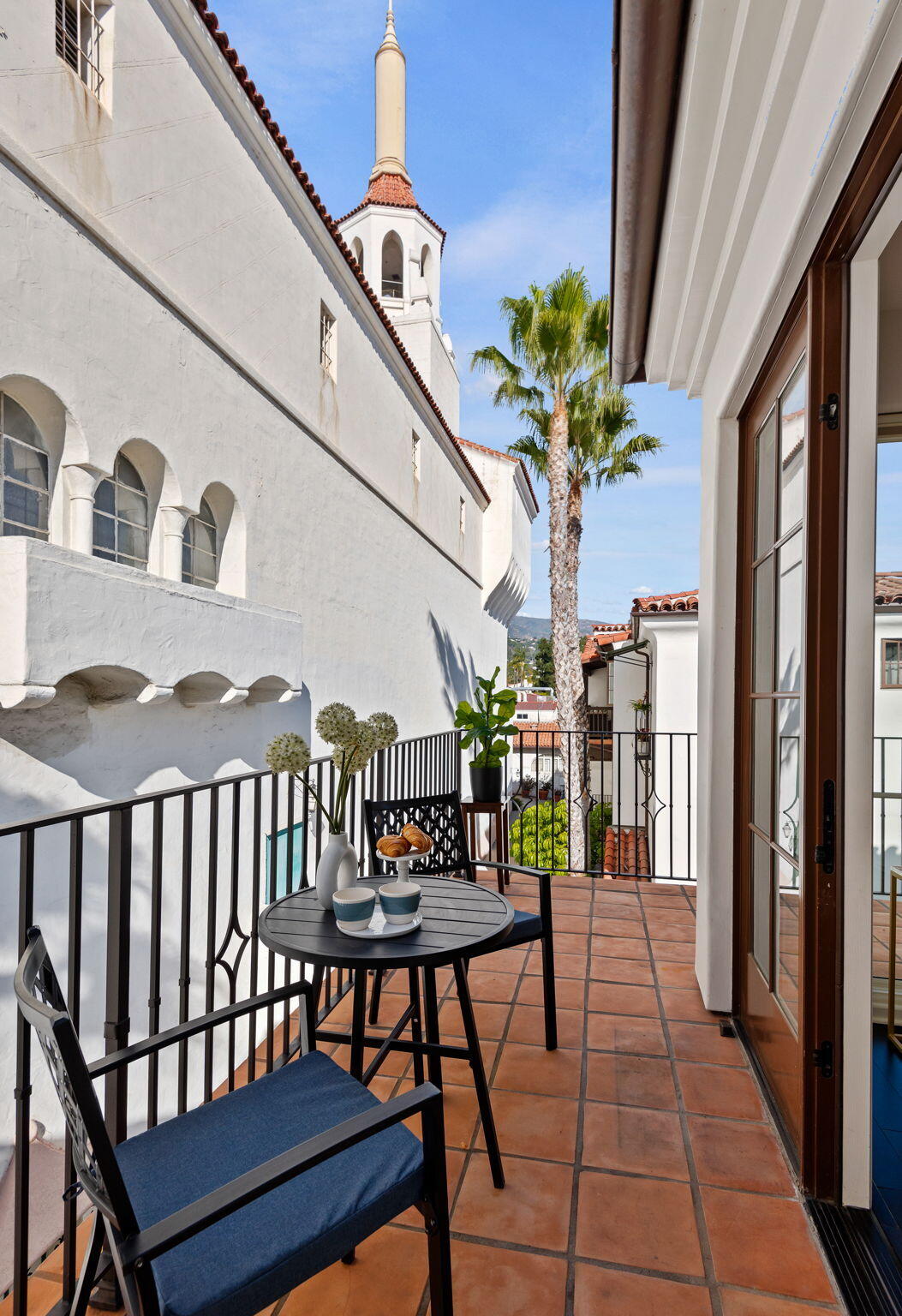 18 West Victoria Street, Unit 303 Santa Barbara, CA 93101 - Photo 21 of 42 a view of a chairs and table in a balcony