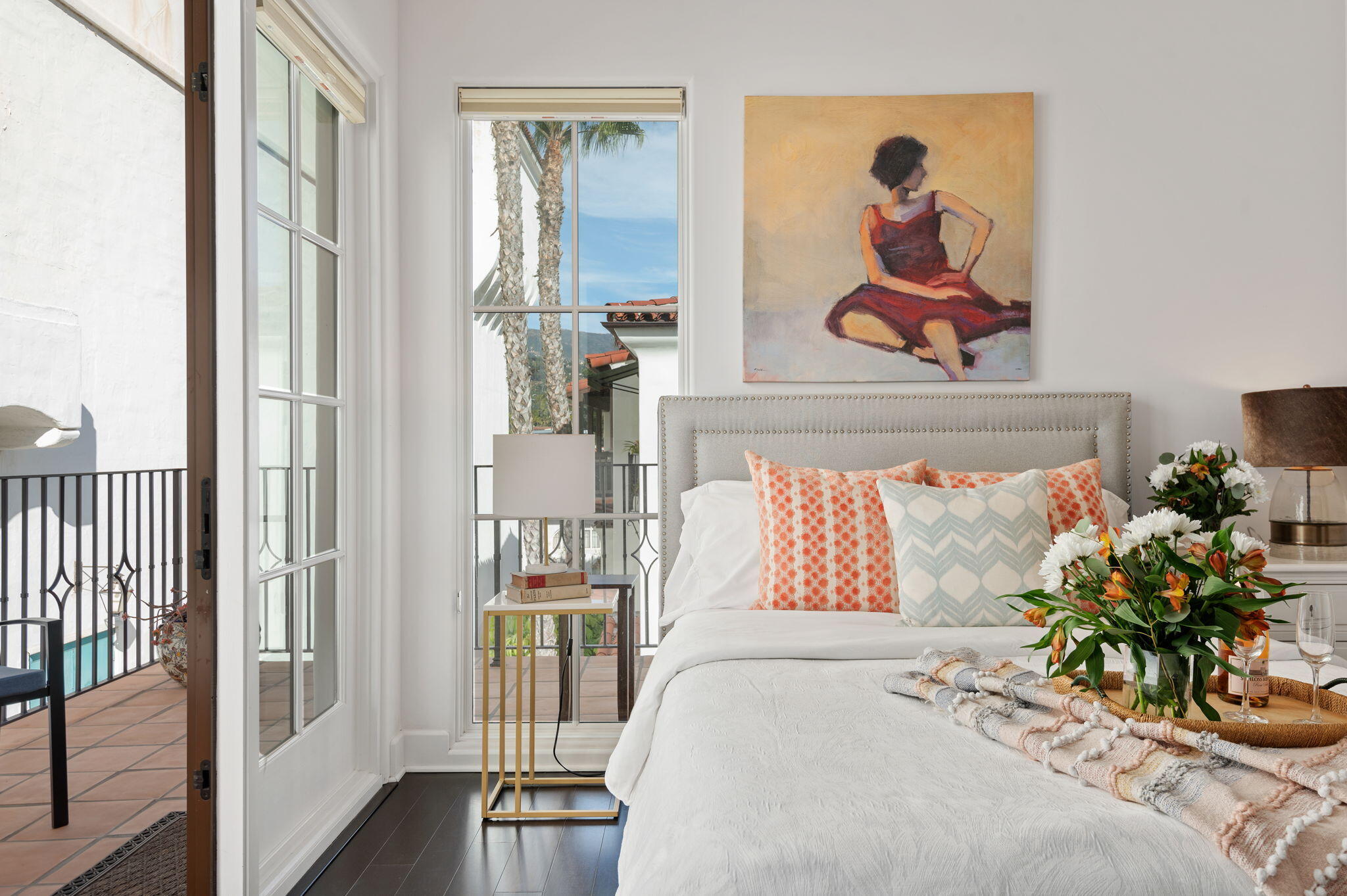 18 West Victoria Street, Unit 303 Santa Barbara, CA 93101 - Photo 22 of 42 a bedroom with a bed and a painting on the wall