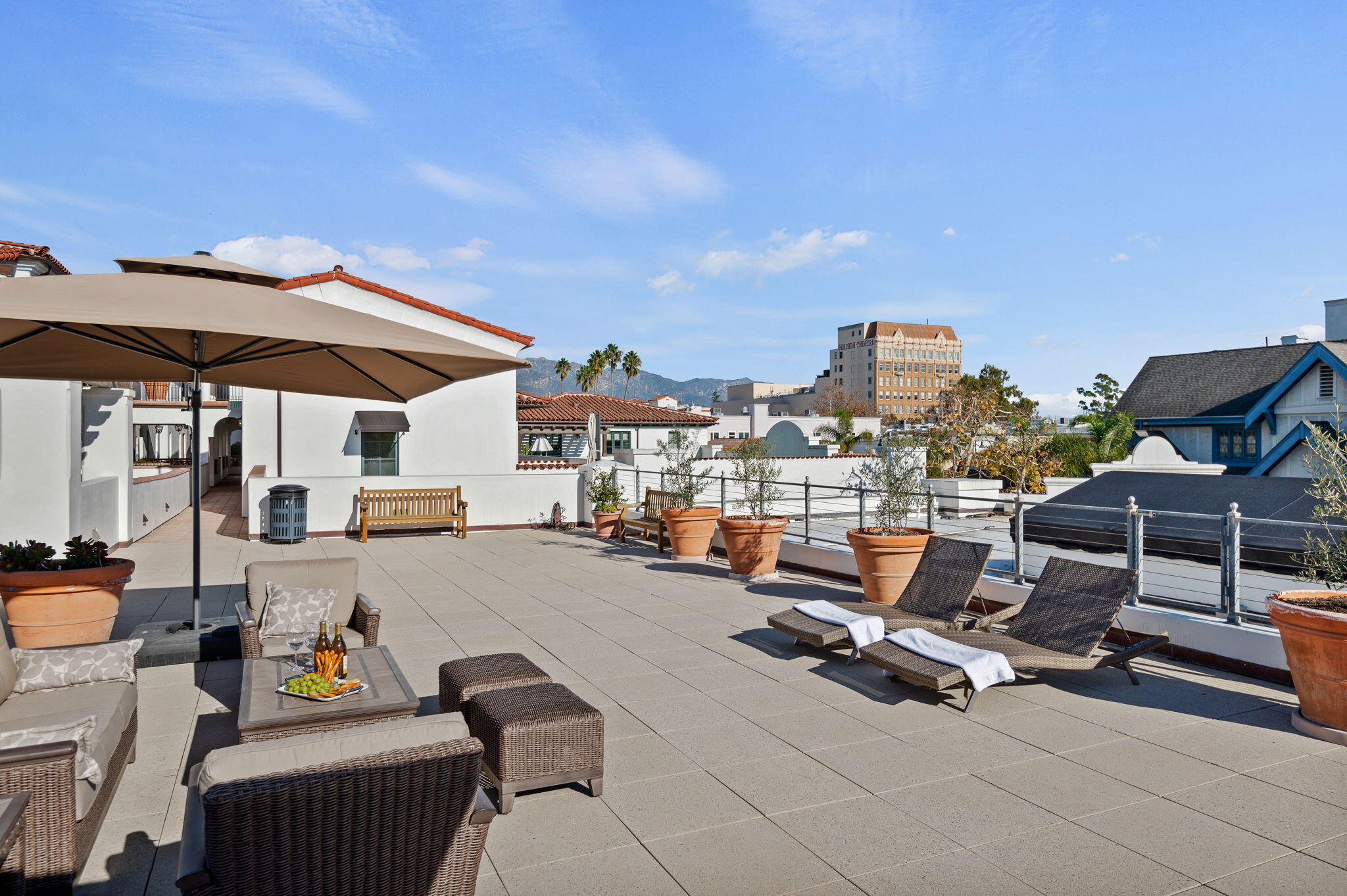 18 West Victoria Street, Unit 303 Santa Barbara, CA 93101 - Photo 35 of 42 a view of a patio with swimming pool table and chairs