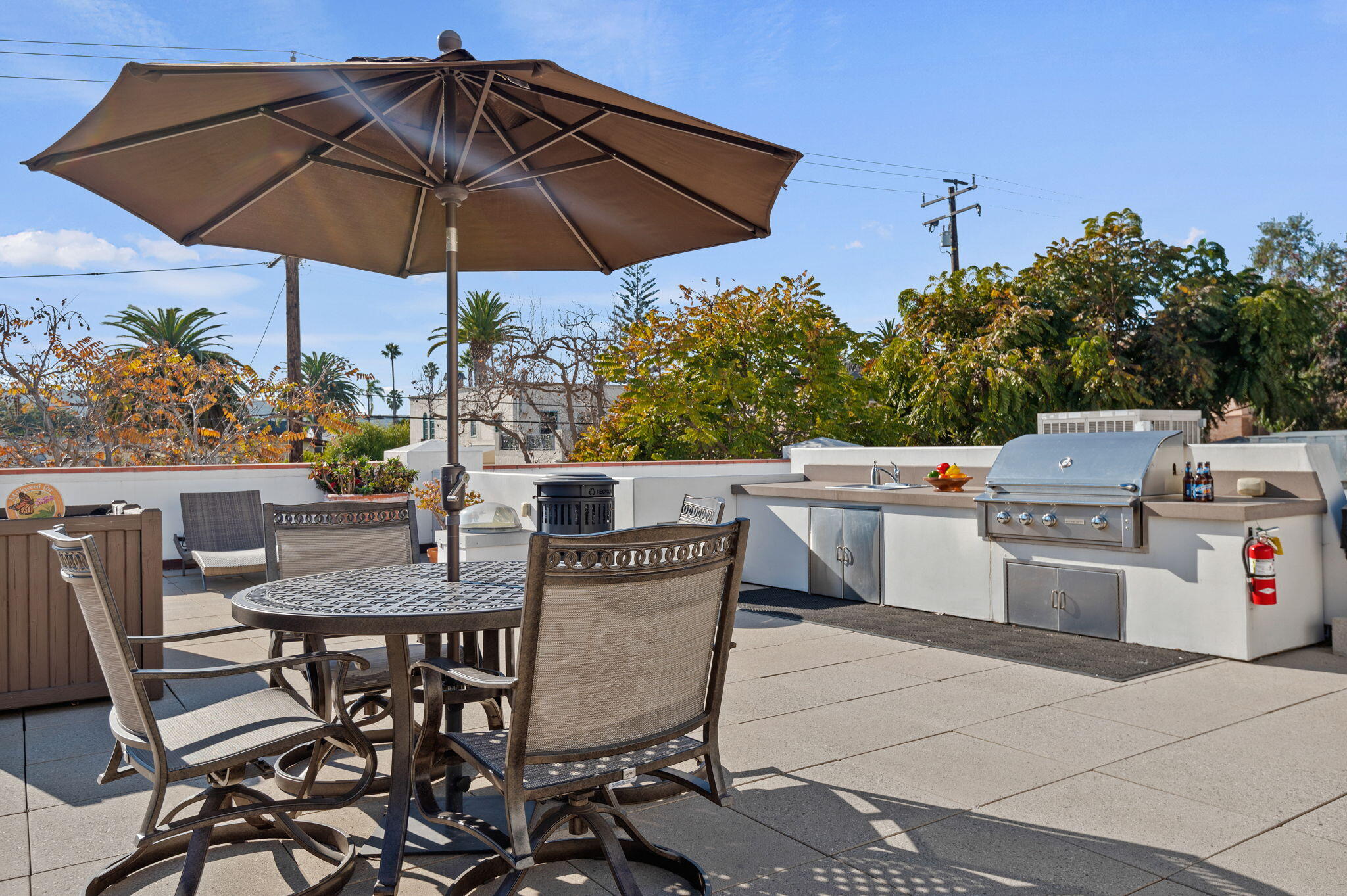 18 West Victoria Street, Unit 303 Santa Barbara, CA 93101 - Photo 36 of 42 a table and chairs in the patio