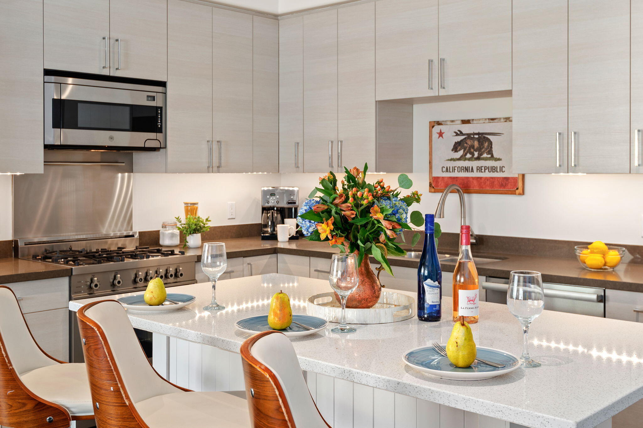 18 West Victoria Street, Unit 303 Santa Barbara, CA 93101 - Photo 10 of 42 a kitchen with a dining table and chairs
