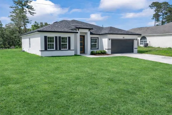 a view of a house with a garden